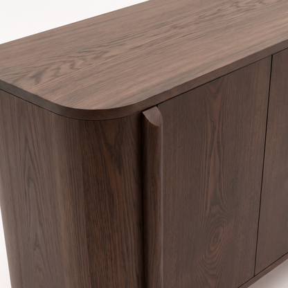Close-up of dark wood cabinet corner and top on white background