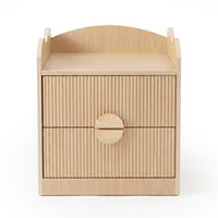 Modern light wood nightstand with ribbed drawers on white background