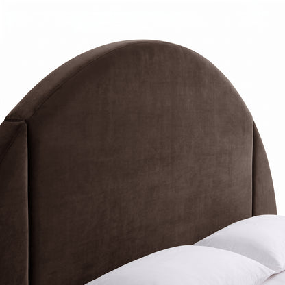 Close-up of a dark upholstered semicircular headboard on a white background