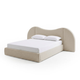 Modern beige upholstered bed with curved headboard on white background