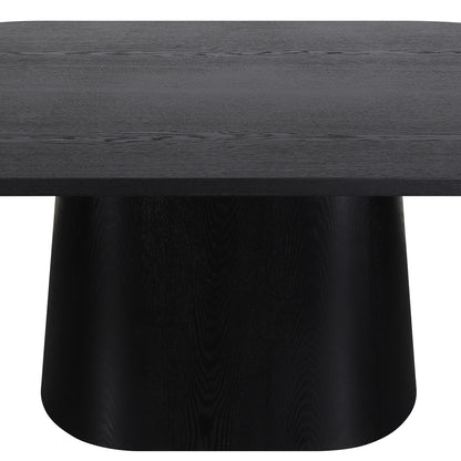 Close-up of black wooden table showing tabletop and pedestal base
