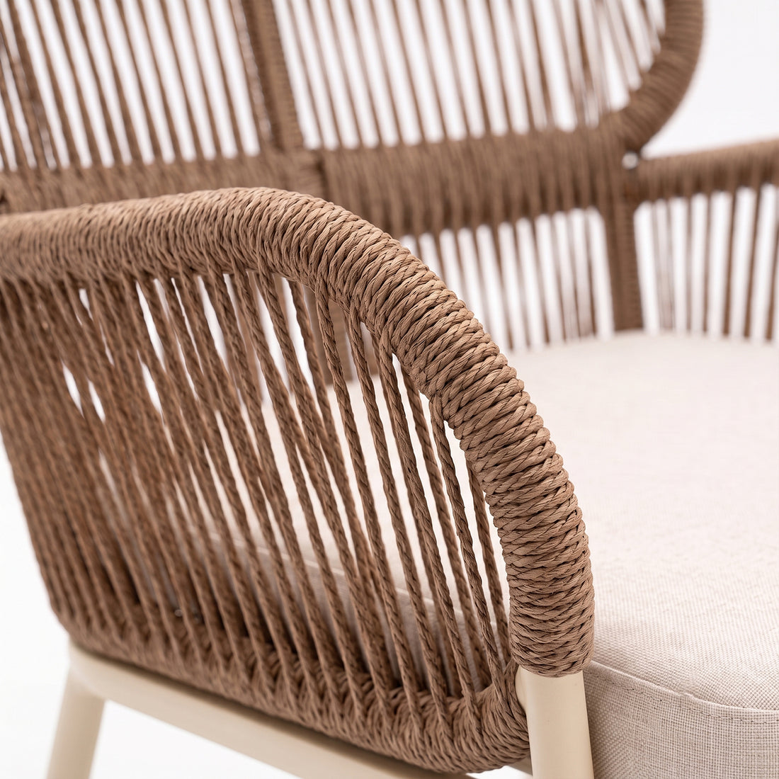 Close-up of woven chair armrest and seat detail
