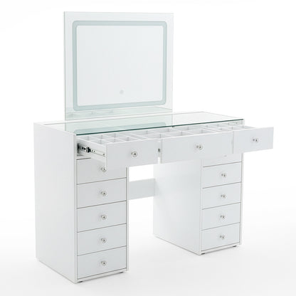 White vanity table with drawers open revealing storage compartments and lifted mirror on white background