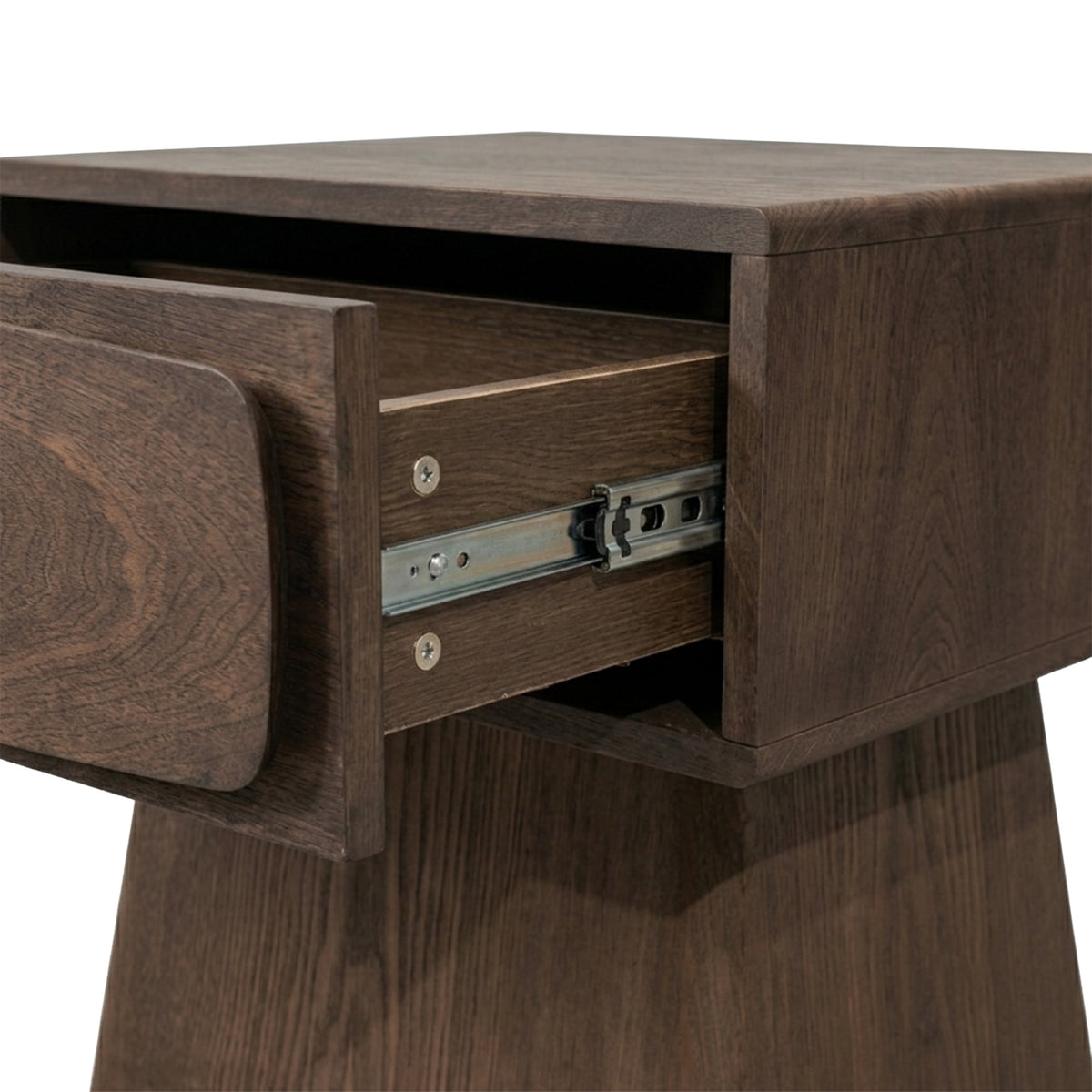 Close view of a wooden nightstand with an open drawer on white background