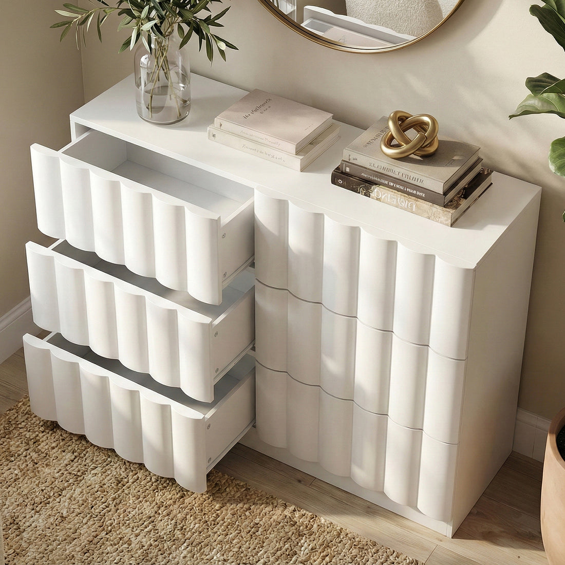 White sculptural dresser with three open drawers in bright room decor