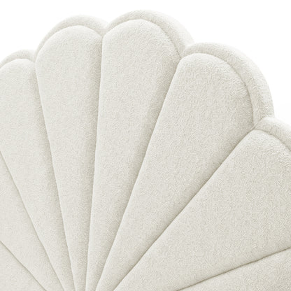 Close-up detail of upholstery and shell pattern on white background
