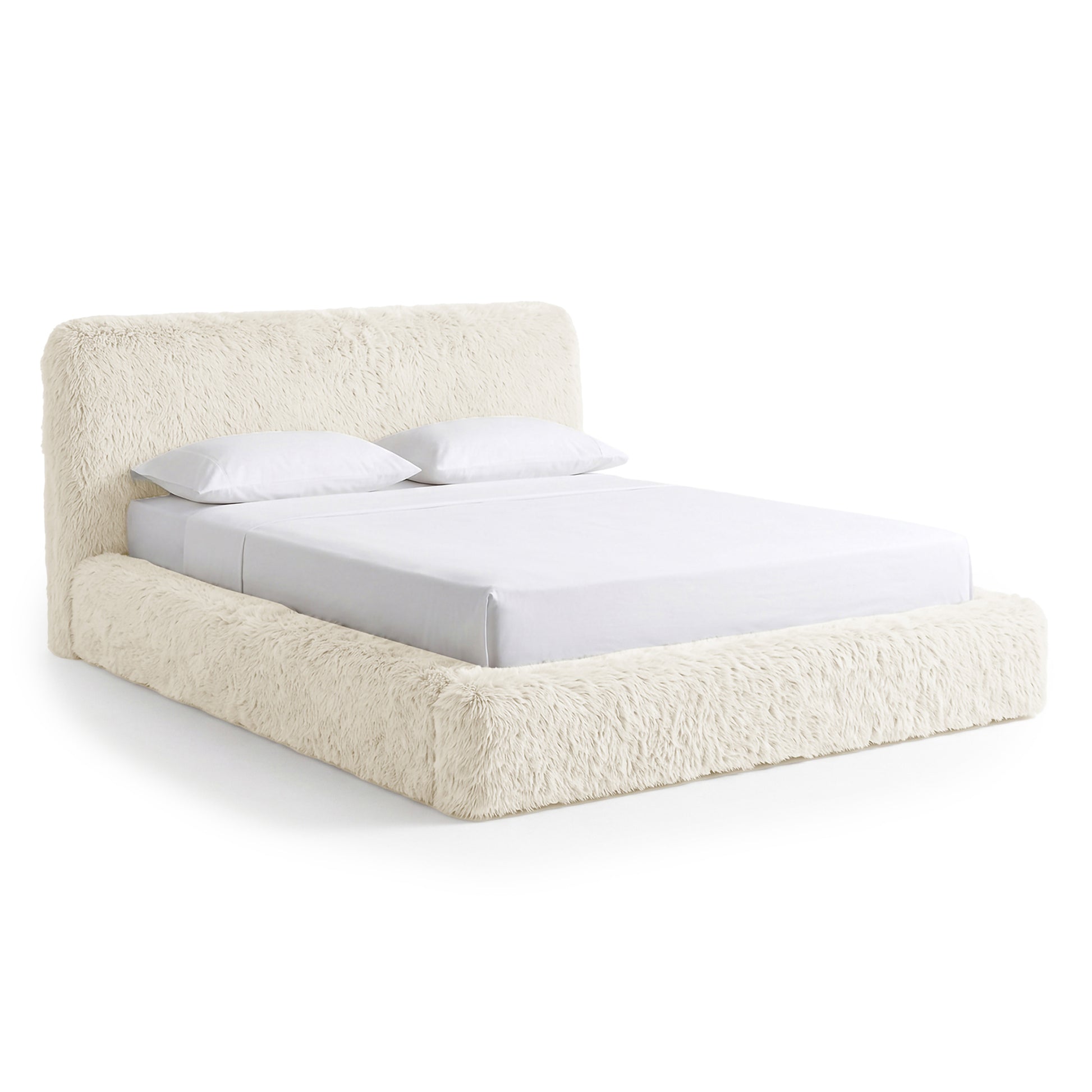 Full modern shaggy upholstered bed on a white background