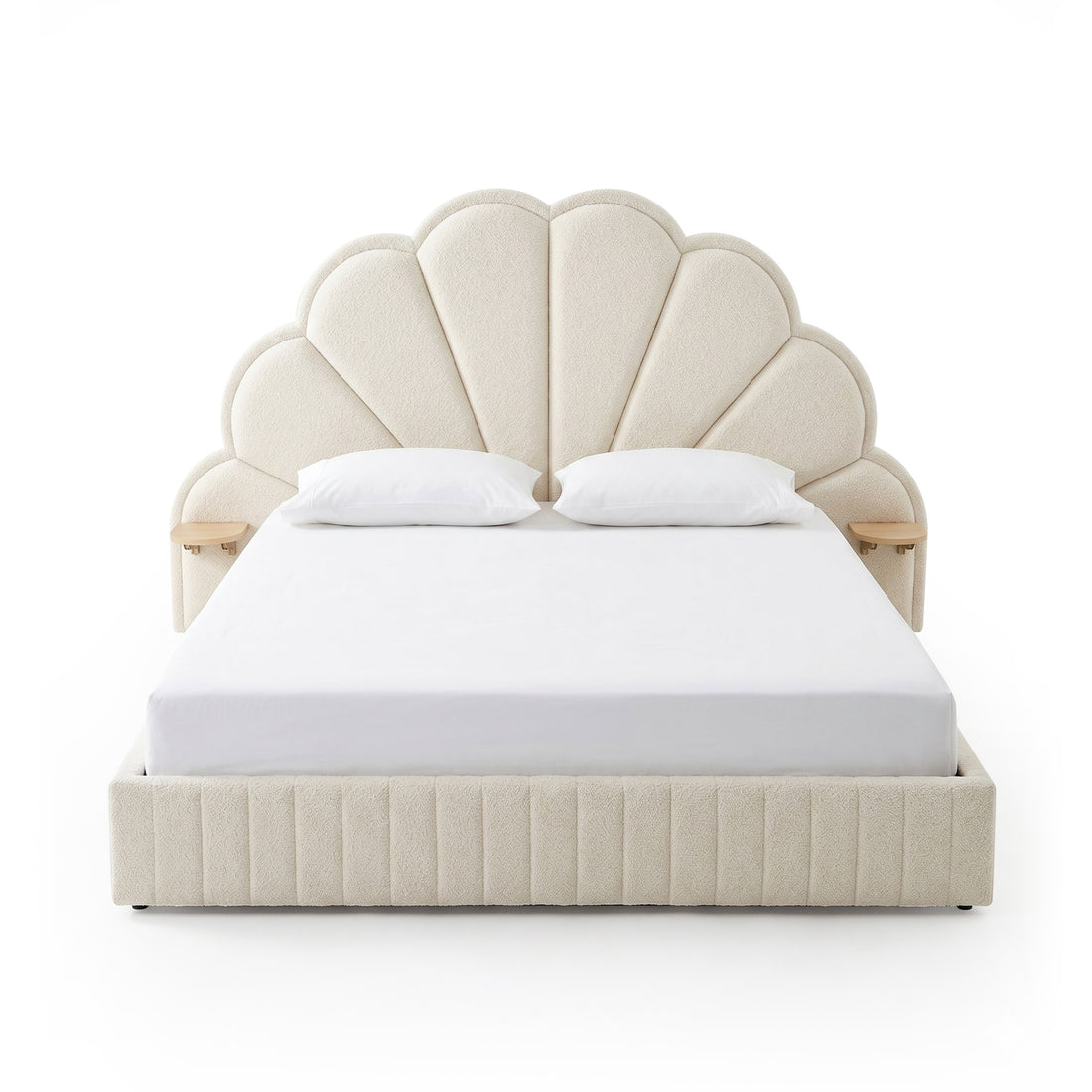 Full view of upholstered bed with scalloped headboard on white background
