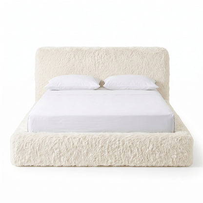 Front view of a cream upholstered bed on a white background.