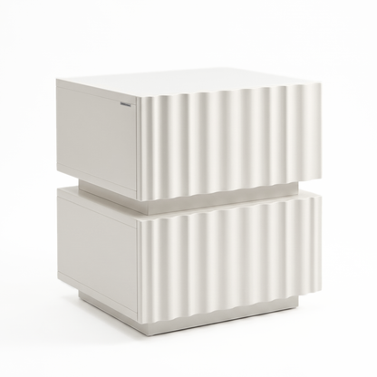 Angled view of a white two-drawer nightstand with ribbed front on a white background.