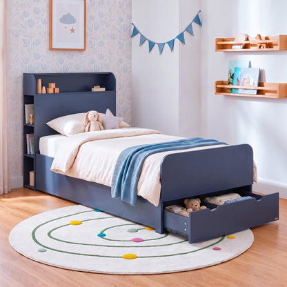 Navy blue children's bed styled in a furnished bedroom