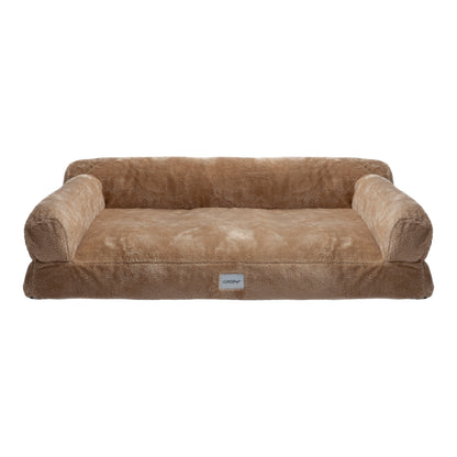 Plush tan dog bed with raised bolsters on white background