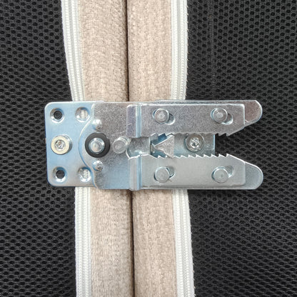 Close-up of a metal latch on upholstered panels