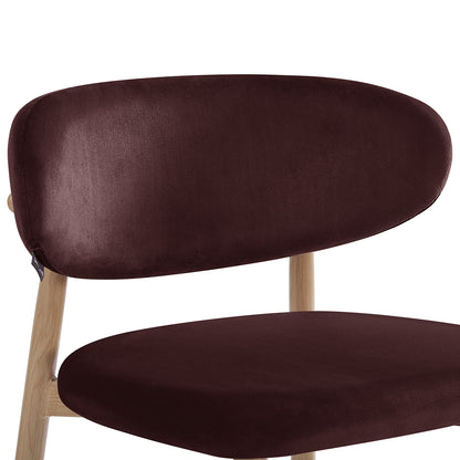 Close-up of Audrey Fabric Dining Chair Set of 2 in Dark Plum, showcasing the deep brown upholstered oval backrest and seat atop light-finished wooden legs, highlighting plush comfort and elegant design.
