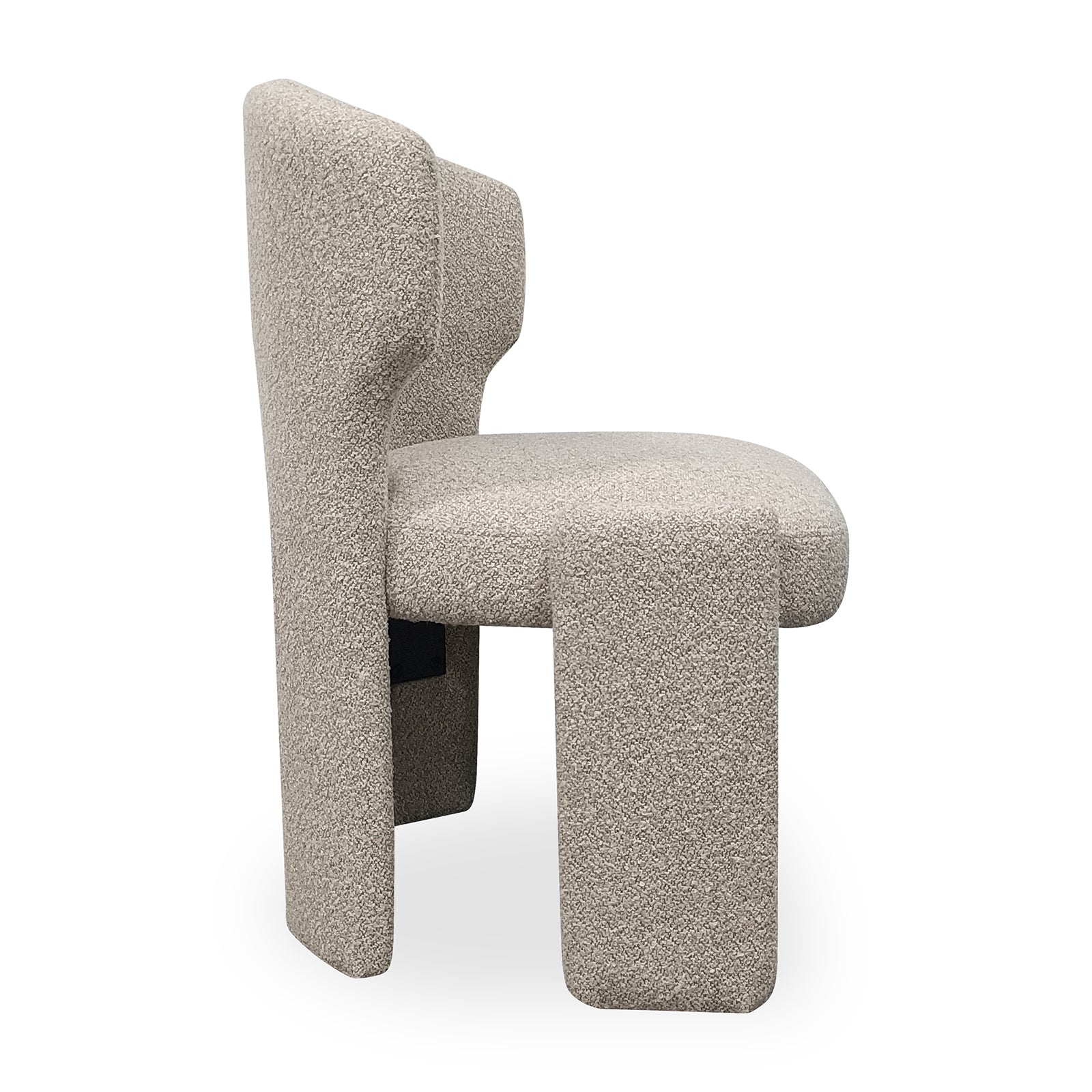 Lunari Bouclé Curved Accent Chair in Beige, showcasing a minimalist design with sculptural block legs, light-beige bouclé upholstery, and a high backrest, viewed from the side.