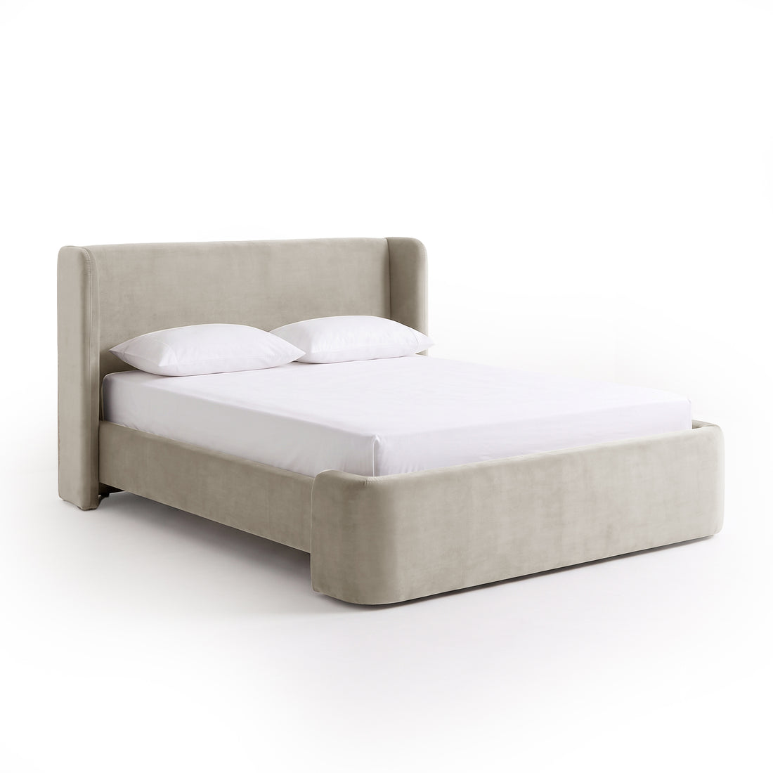 Angled view of a modern upholstered bed on a white background