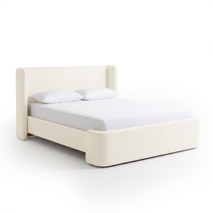 Full upholstered bed on a plain white background