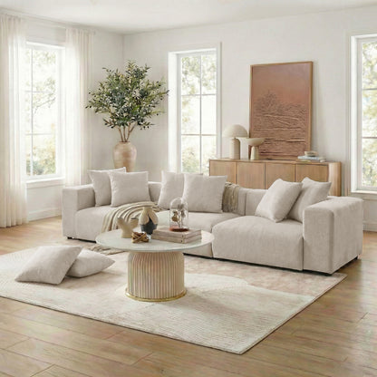 Beige sectional sofa in bright living room with decor