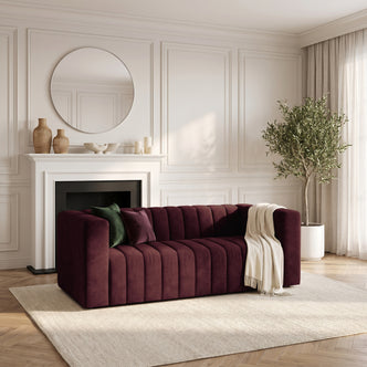 Dark Merlot velvet sofa in an elegant living room setting