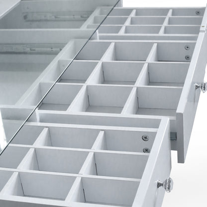 Close-up of vanity drawers and compartments on white background
