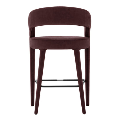 Eisha Velvet Bar Stool Set of 2 in Dark Plum, featuring a modern design with rounded backrest, padded seat in burgundy fabric, tapered legs, and metal footrest for sleek, comfortable seating.