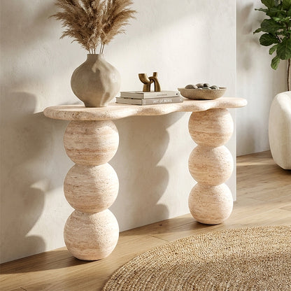 Modern sculptural console table styled in sunlit room with decor