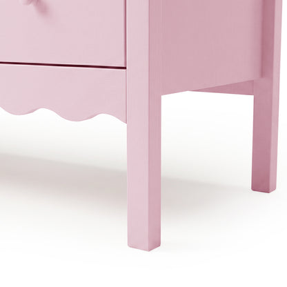 Close-up of pink dresser scalloped edge and drawer knob