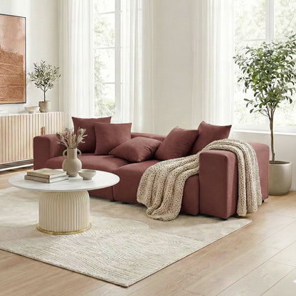 Burgundy sectional sofa in styled living room