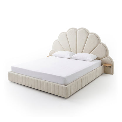 Upholstered bed with scalloped headboard on white background