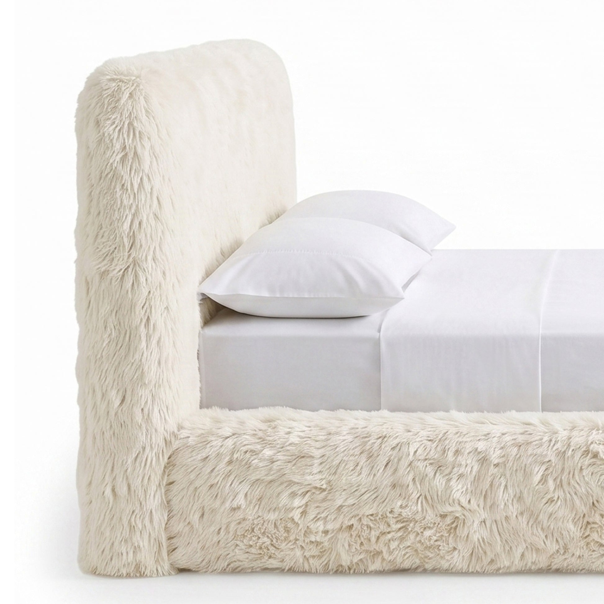 Cropped close view of a plush upholstered bed on a white background