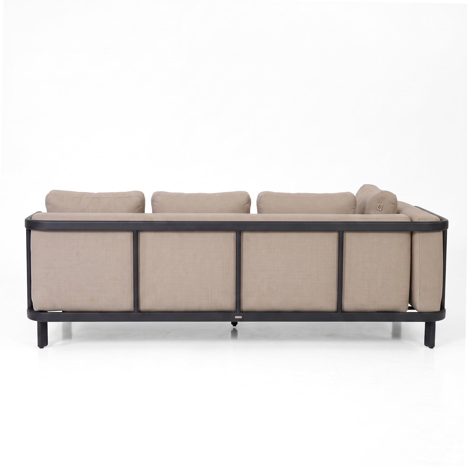 Back view of a modern beige sofa on white background.