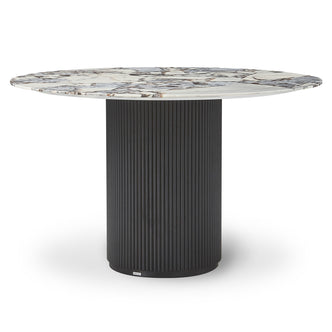 Gracie 120cm Round Marble Dining Table in Black features a white marble tabletop with distinctive veining, supported by a vertically-fluted black cylindrical base, creating a luxurious and sturdy centerpiece.