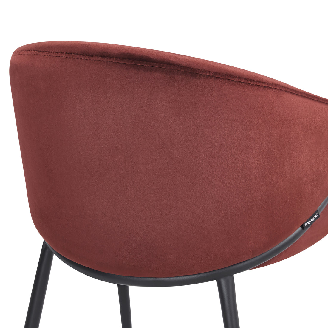 Detail of burgundy chair’s backrest and seat on white background