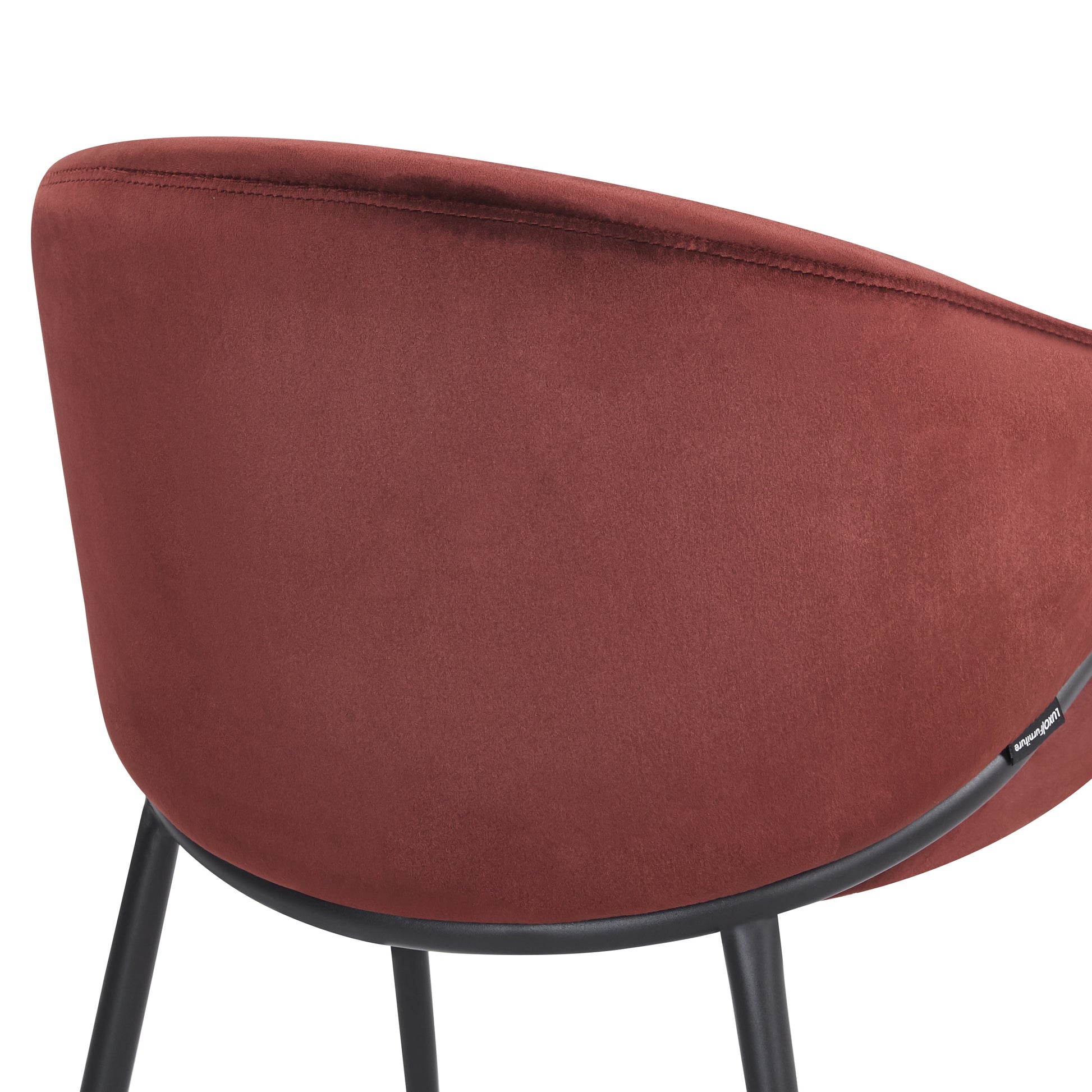 Detail of burgundy chair’s backrest and seat on white background