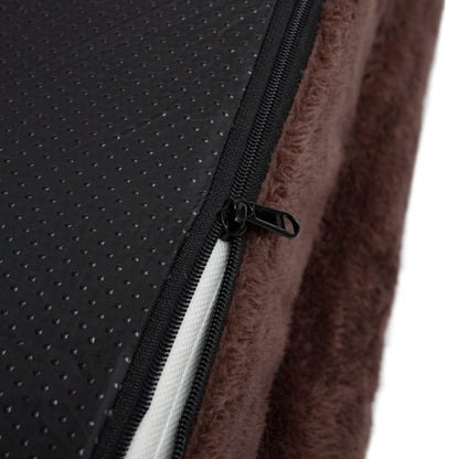 Close-up of brown fabric and zipper detail against white background