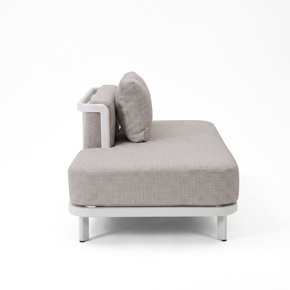 Side profile of a modern cushioned sofa on a white background.