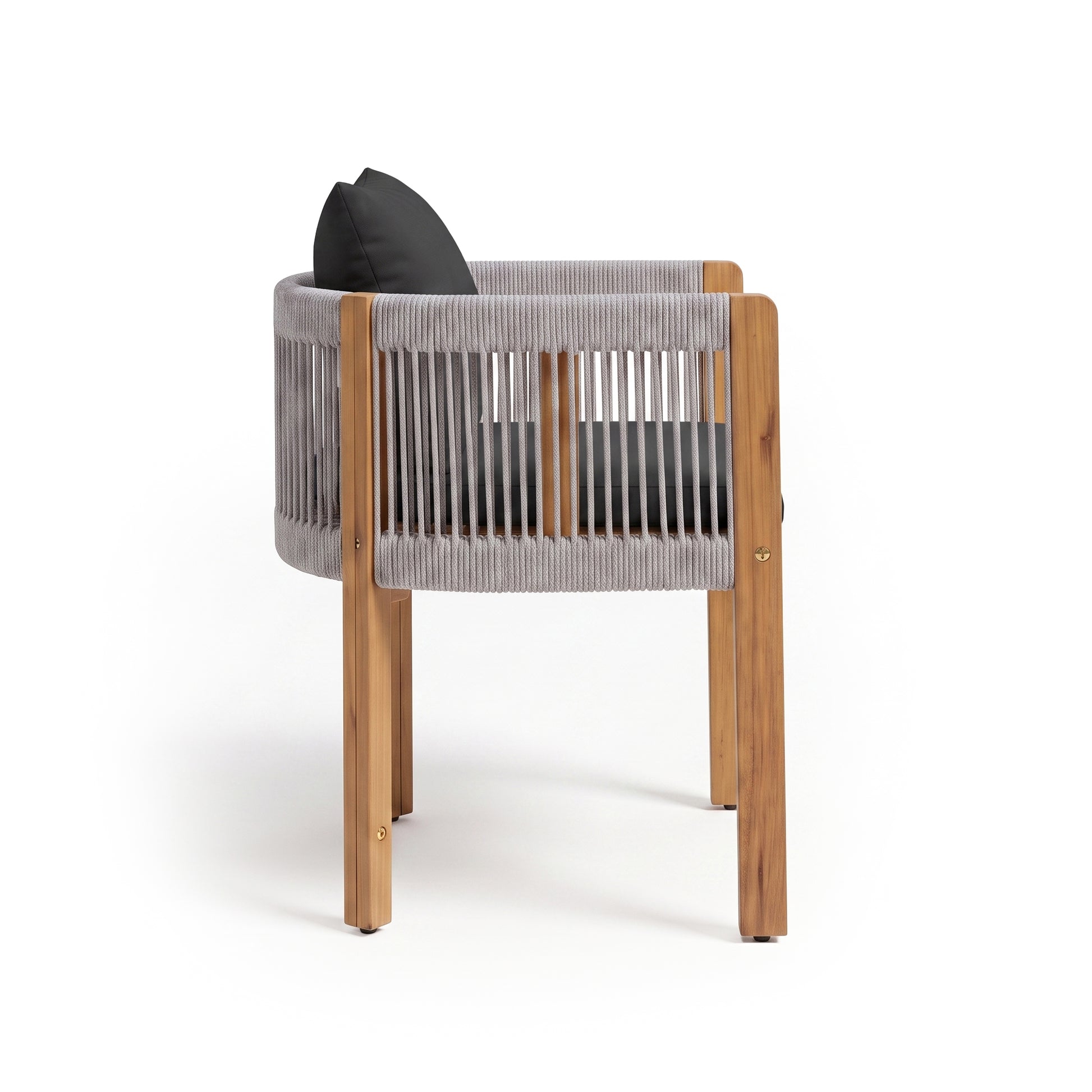 Wooden chair with woven back and dark cushions on a white background, angled rear view