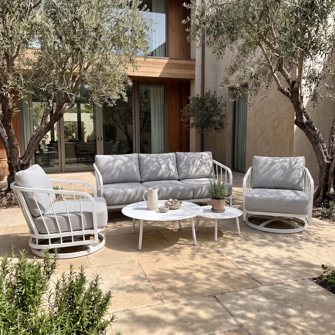 Outdoor patio furniture set staged in a garden setting