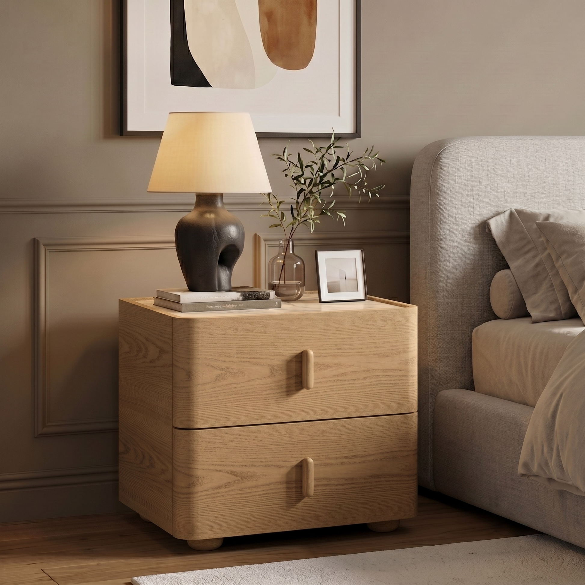 Light wood two-drawer nightstand styled beside a bed in a modern bedroom