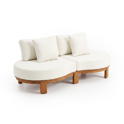Two-piece curved sofa section with three white back cushions and a wooden base on white.