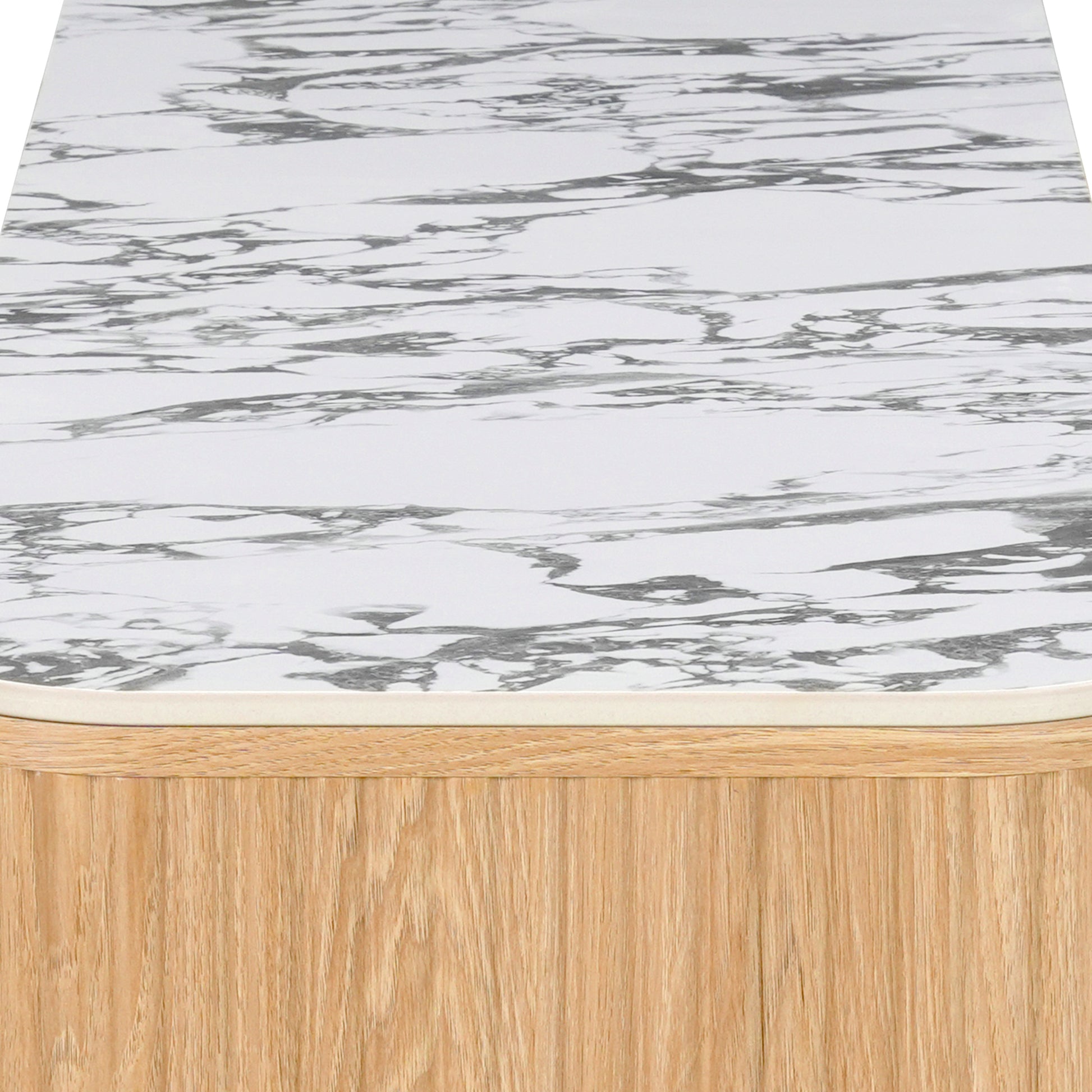 Close-up of marble-patterned tabletop corner with light wood side on white background