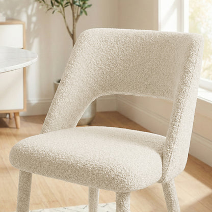 Cream chair in lifestyle setting with partial top and leg cropped