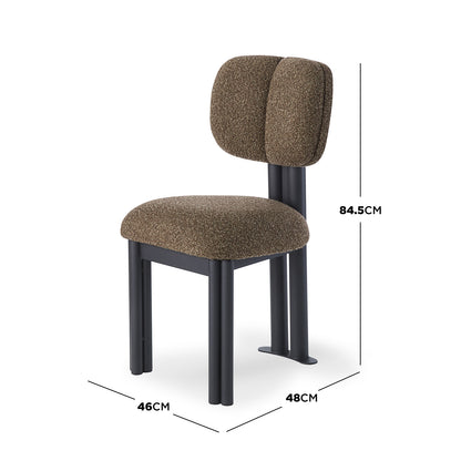 Norii Boucle Fabric Dining Chair in Rust Brown, featuring a textured upholstered seat, dual-padded backrest, and sleek black tubular-metal legs, offers modern elegance and comfort for dining spaces.
