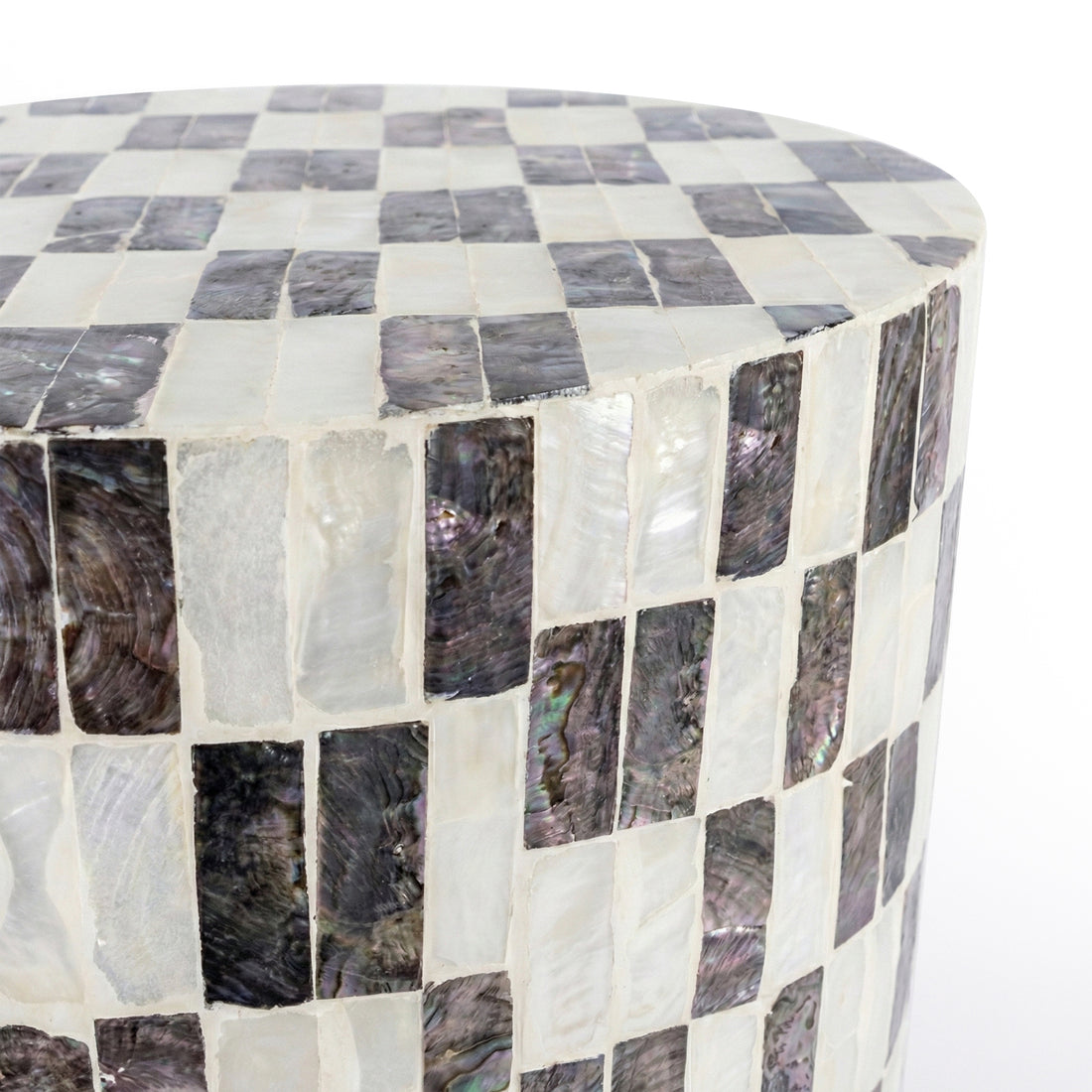 Close-up partial view of checkered mosaic side table on white background