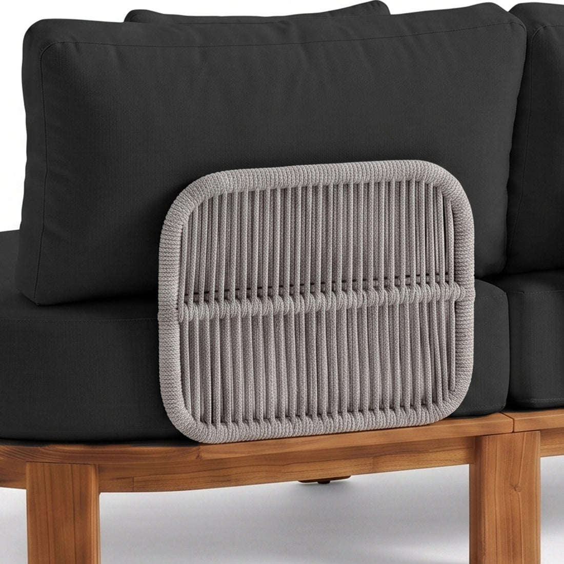 Partial view of outdoor furniture with cushions and woven backrest detail on white background
