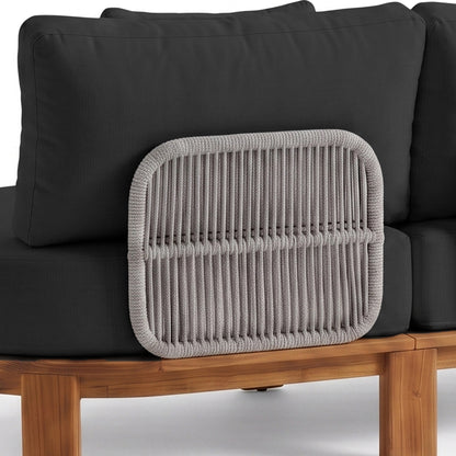 Partial view of outdoor furniture with cushions and woven backrest detail on white background