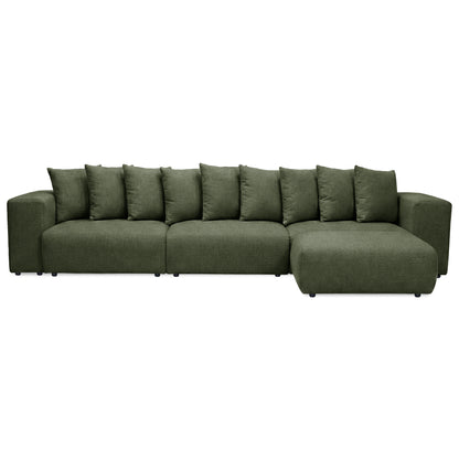Green sectional sofa with wide arms and cushions on white background