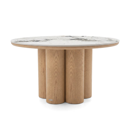 Round accent table with clustered cylindrical wooden base and marble-look top on a white background