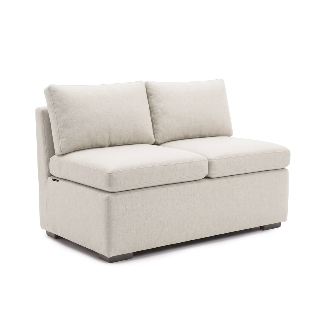 Complete cream armless loveseat viewed from the front three-quarter angle