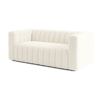 Modern cream-colored sofa on a white background